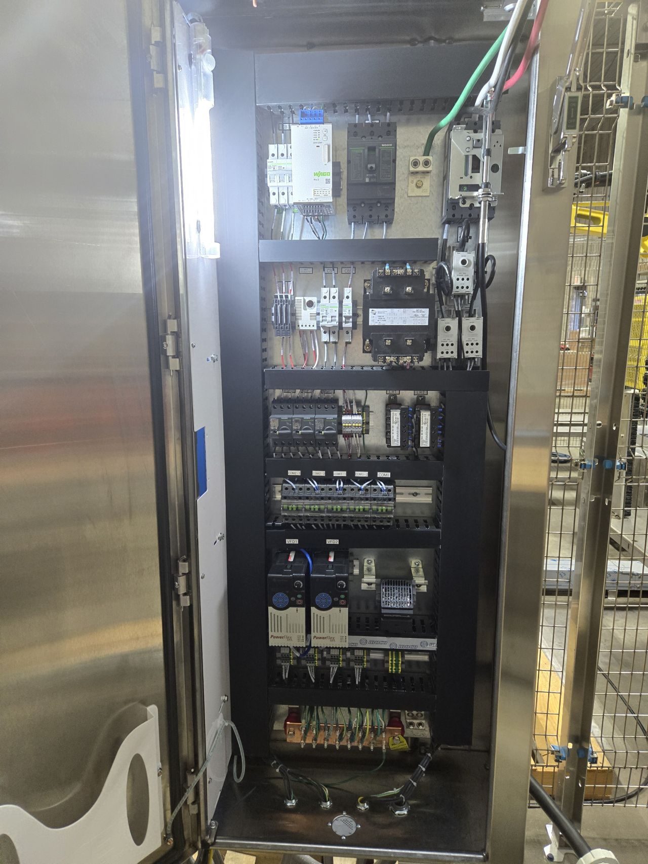 Control cabinet interior with breakers, contactors, and distribution